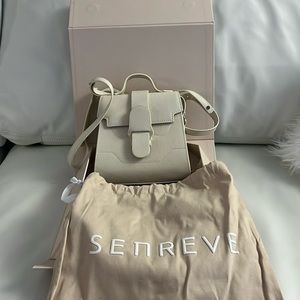 Brand new Senreve mini alunna bag in sand color.